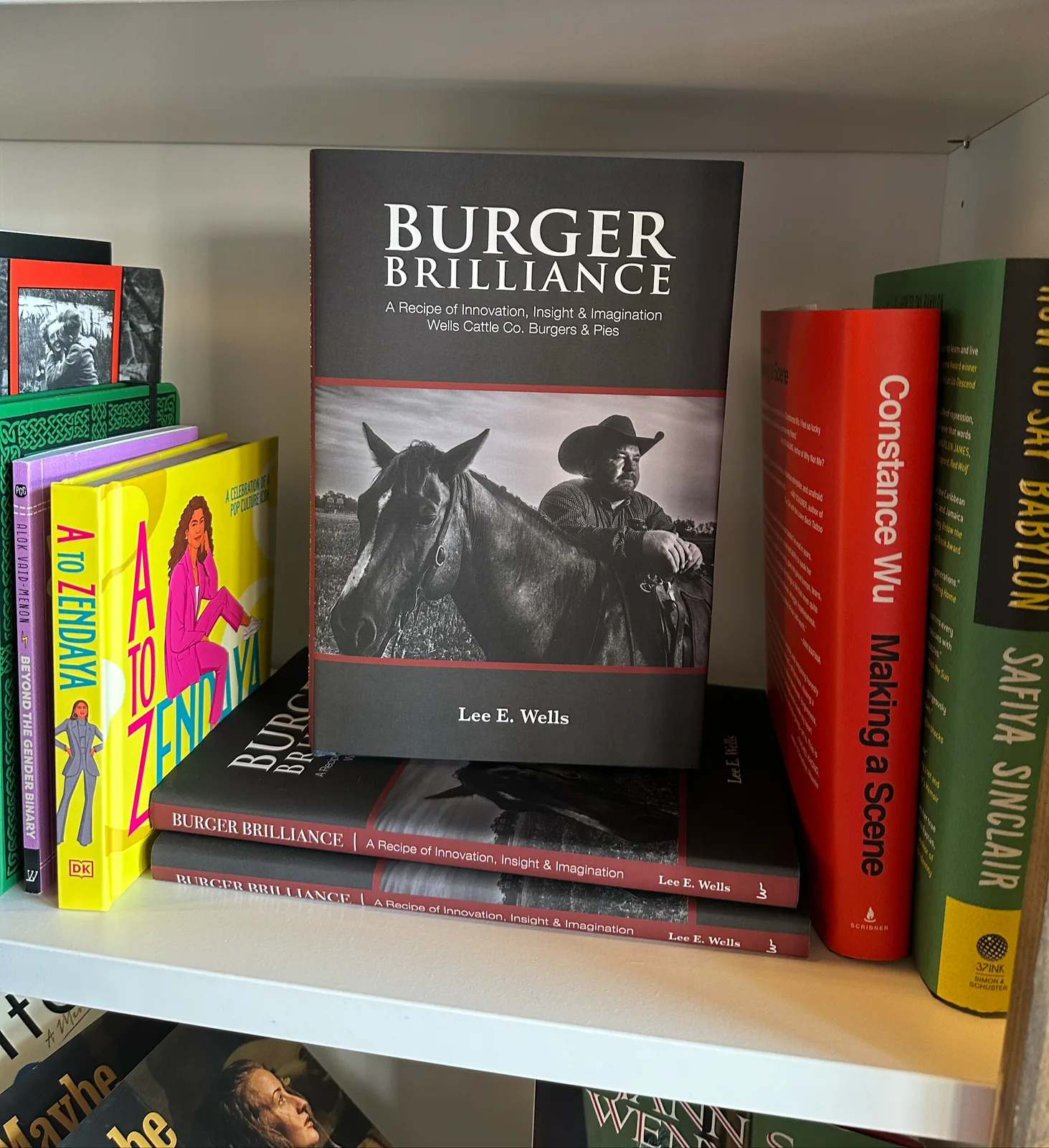 Burger Brilliance on the shelf at a Rockwall bookstore, copies stacked beneath